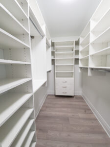 An interior of a house with light color walls and white cabinets